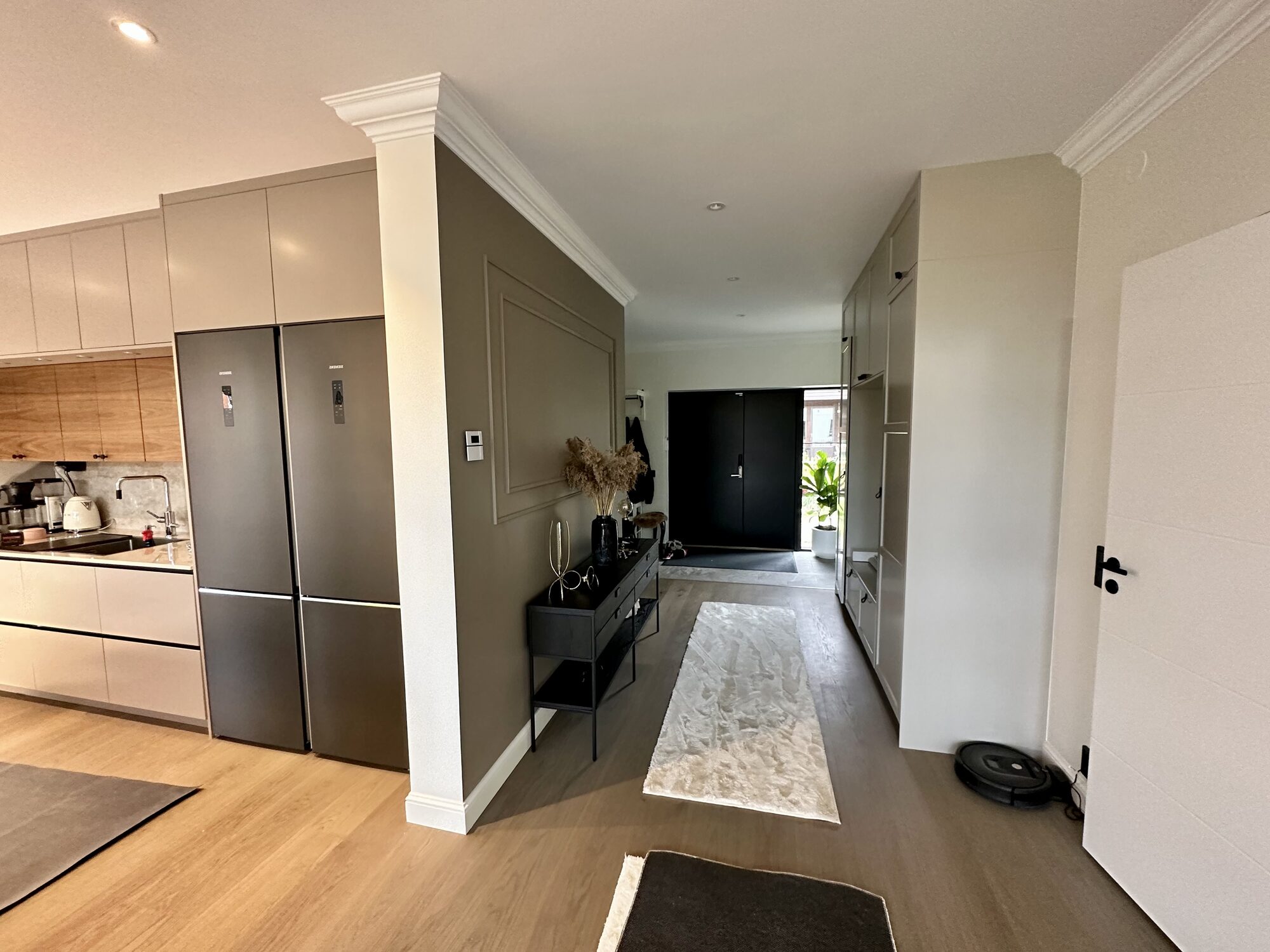 Finished hallway with fitted storage and oak flooring in a GLD Group home