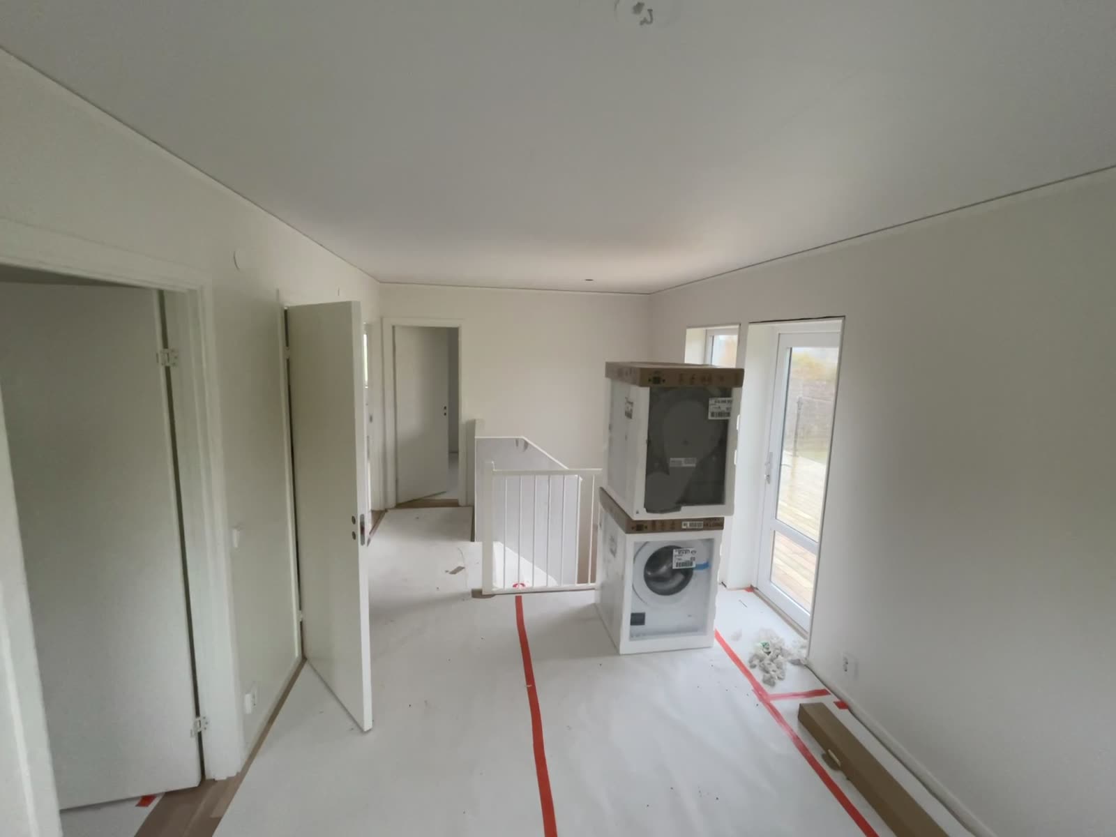 Upper floor landing with utility area and daylight from the stairwell