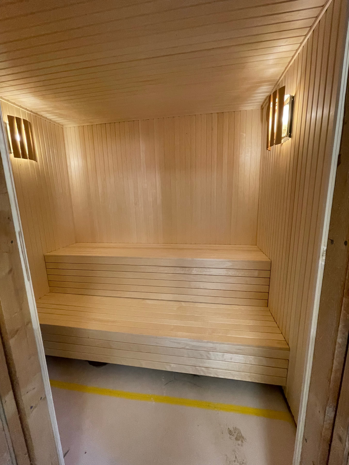 Finished sauna seen through the doorway before handover