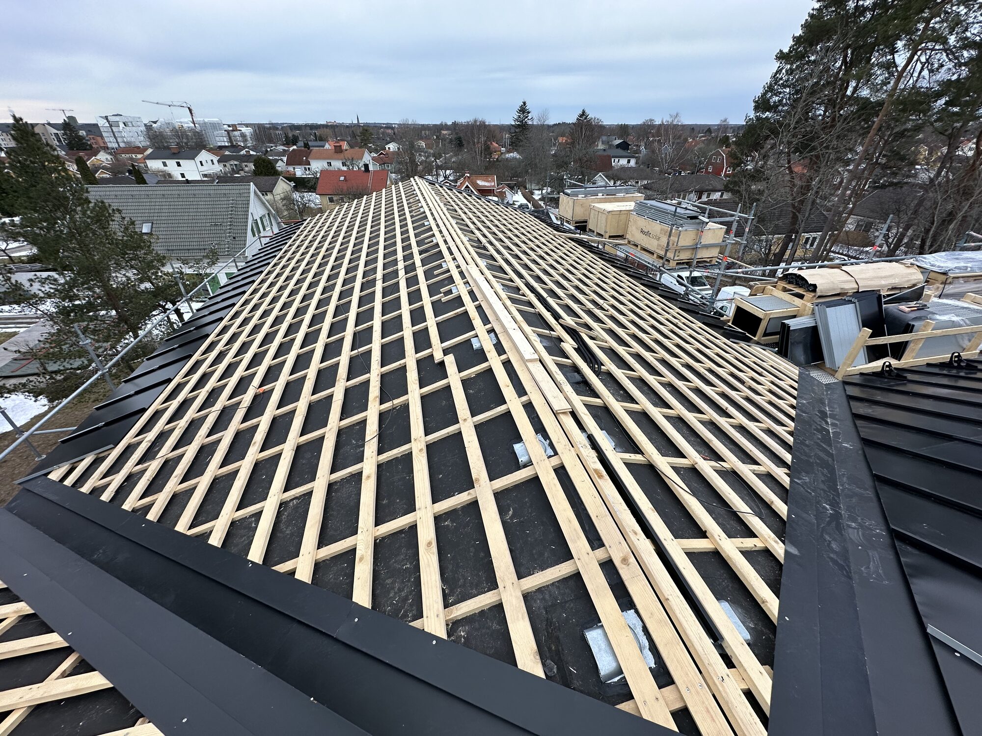 New counter-battens and battens set out across the full roof before covering