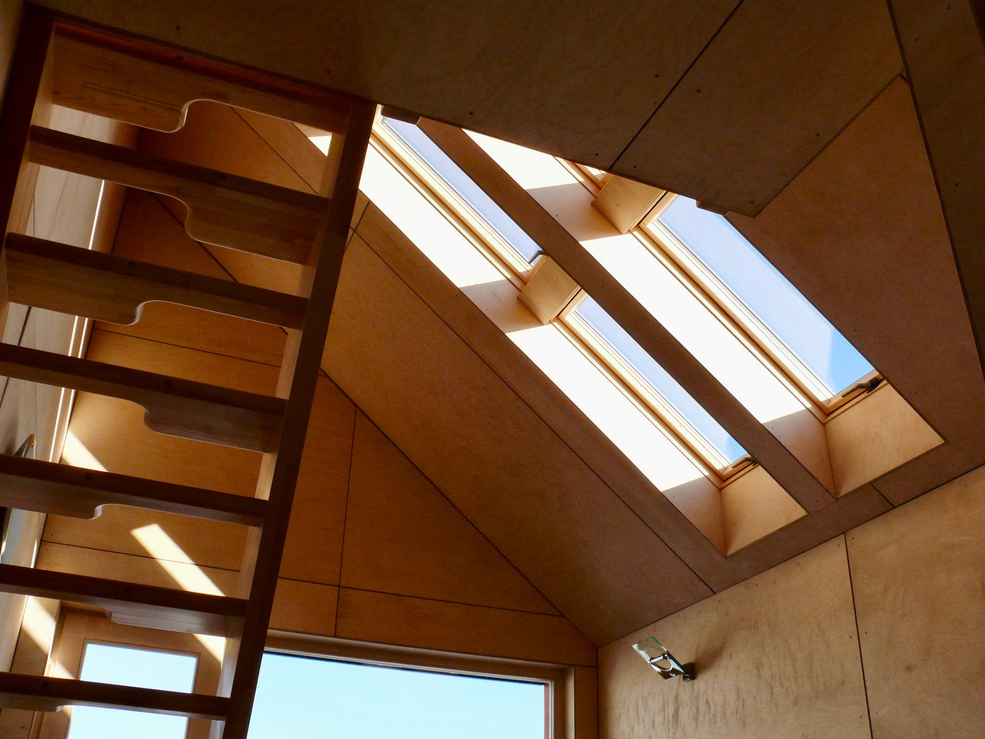 Birch plywood interior with sleeping loft and roof windows
