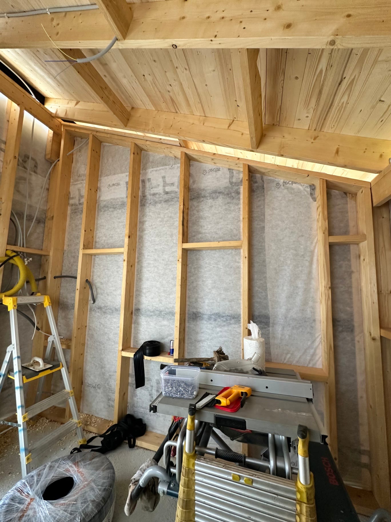 Timber frame and vapour barrier inside the garden annex during construction