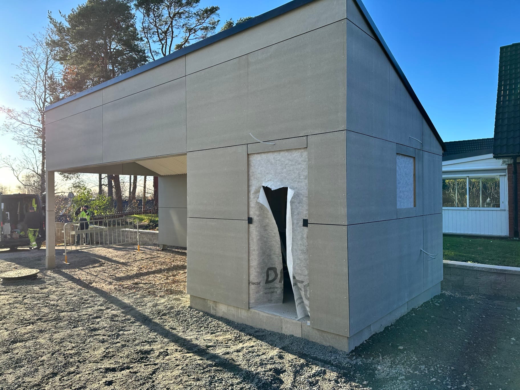 Detached garden annex with carport under construction